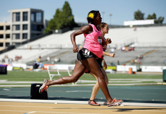 SACRAMENTO, CA - JUNE 26:  A pregnant Alysia Montano runs in the opening round of the women's 800 meter run during day 2 of the USATF Outdoor Championships at Hornet Stadium on June 26, 2014 in Sacramento, California.  (Photo by Ezra Shaw/Getty Images)