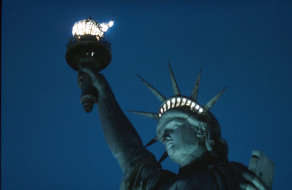 NEW YORK - JANUARY 1942: A view of the Statue of Liberty at night as the torch is lit, on Liberty Island in New York, January 1942. (Photo by Ivan Dmitri/Michael Ochs Archives/Getty Images)