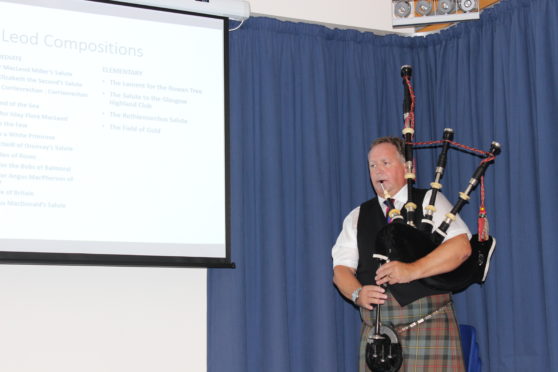 Roddy Macleod, director of the National Piping Centre and technical adviser on the book, playing a piobaireachd at the launch