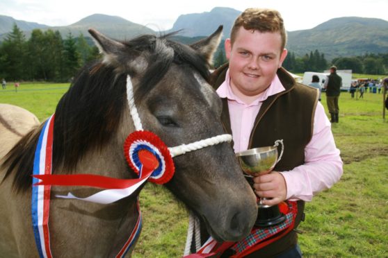 Craig MacKinnion of Kingussie with the champion horse at the Lochaber Agricultural Show