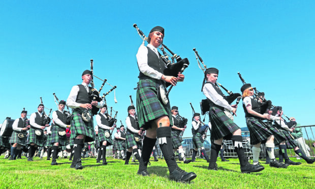 Wick Pipe Band perform during the Mey Highland & Cultural Games at the John O'Groats Showground in Caithness.
Picture: Andrew Milligan/PA Wire
