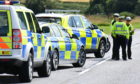 Police at the scene of the collision on the A97 near Kildrummy.