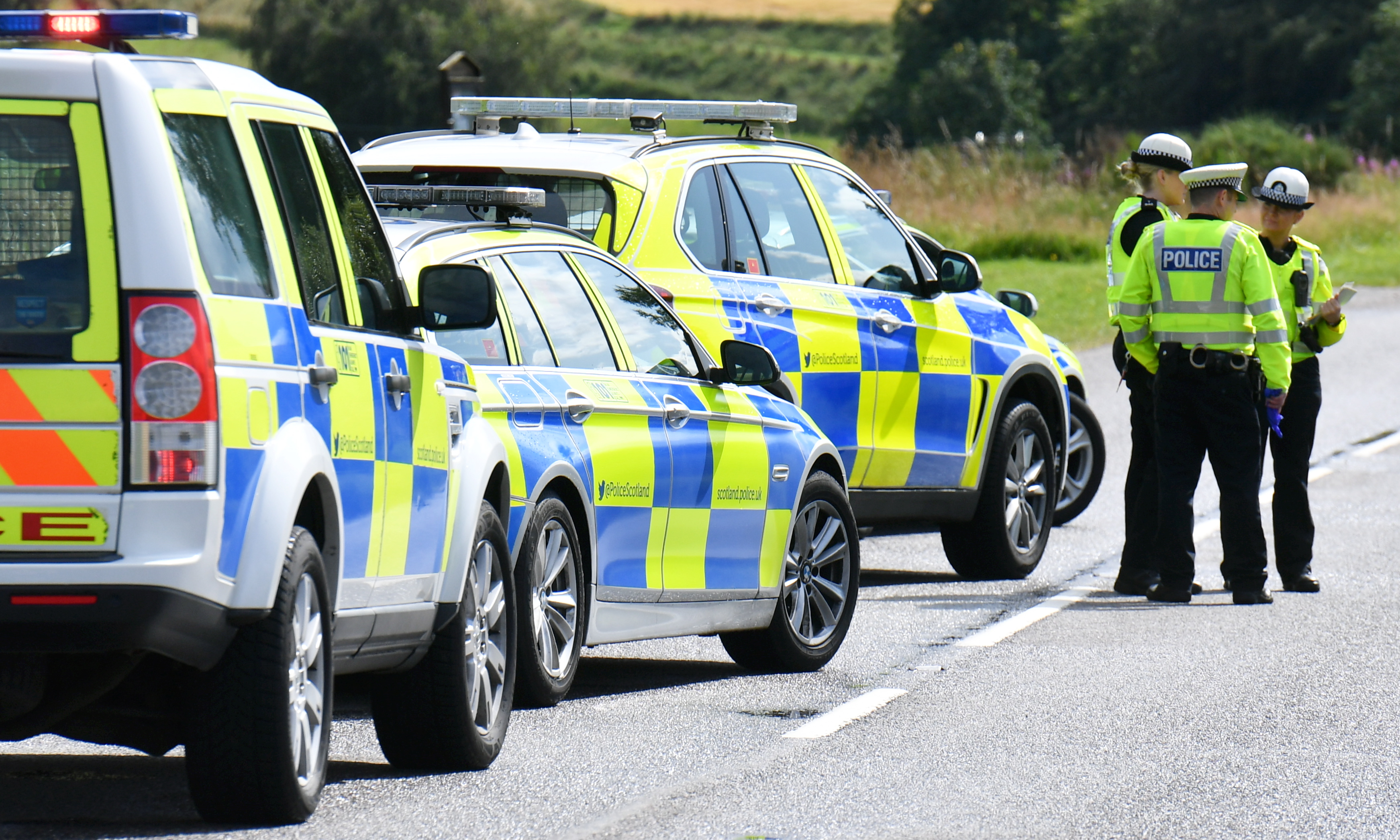 Police at the scene of the collision on the A97 near Kildrummy.