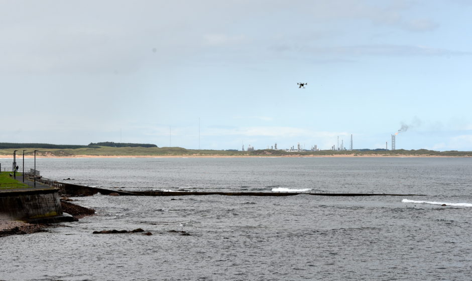 Police officers using a drone at Gadle Braes in Peterhead.