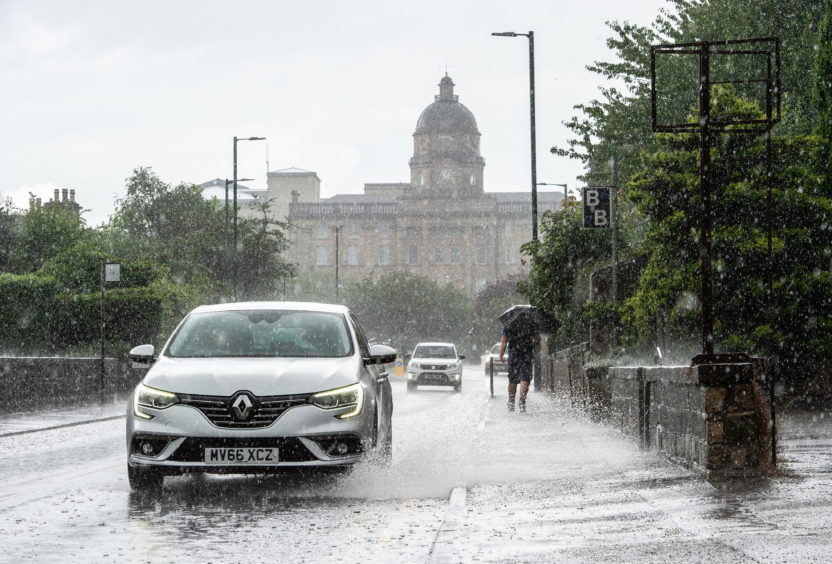 A very quick and heavy downpour of rain in Elgin leaves some flash flooding.