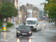 Cars struggled to make it through the deluge in Elgin.
