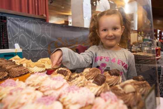 Evie Stewart, five, from Elgin, picks her favourite cake at Elgin Food and Drink Festival 2019