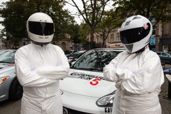 Martin Rush, Left and Erin Keith, right are pictured as Stigs from Top Gear
Picture by JASON HEDGES
