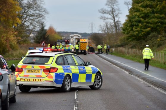 Police at the crash site on the A96 between Lhanbryde and Elgin.