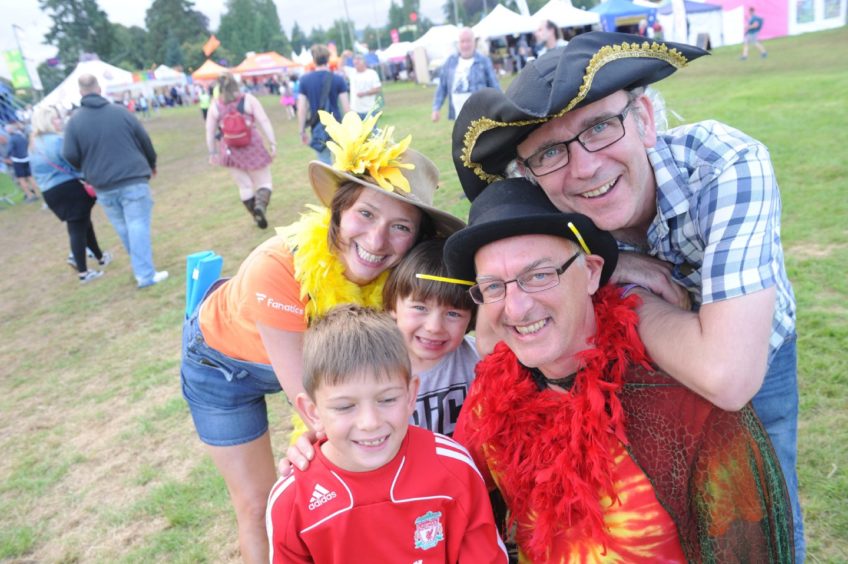 Morag Morrison of Edinburgh with her two sons, Cameron and Mack as they enjoy the festivities.