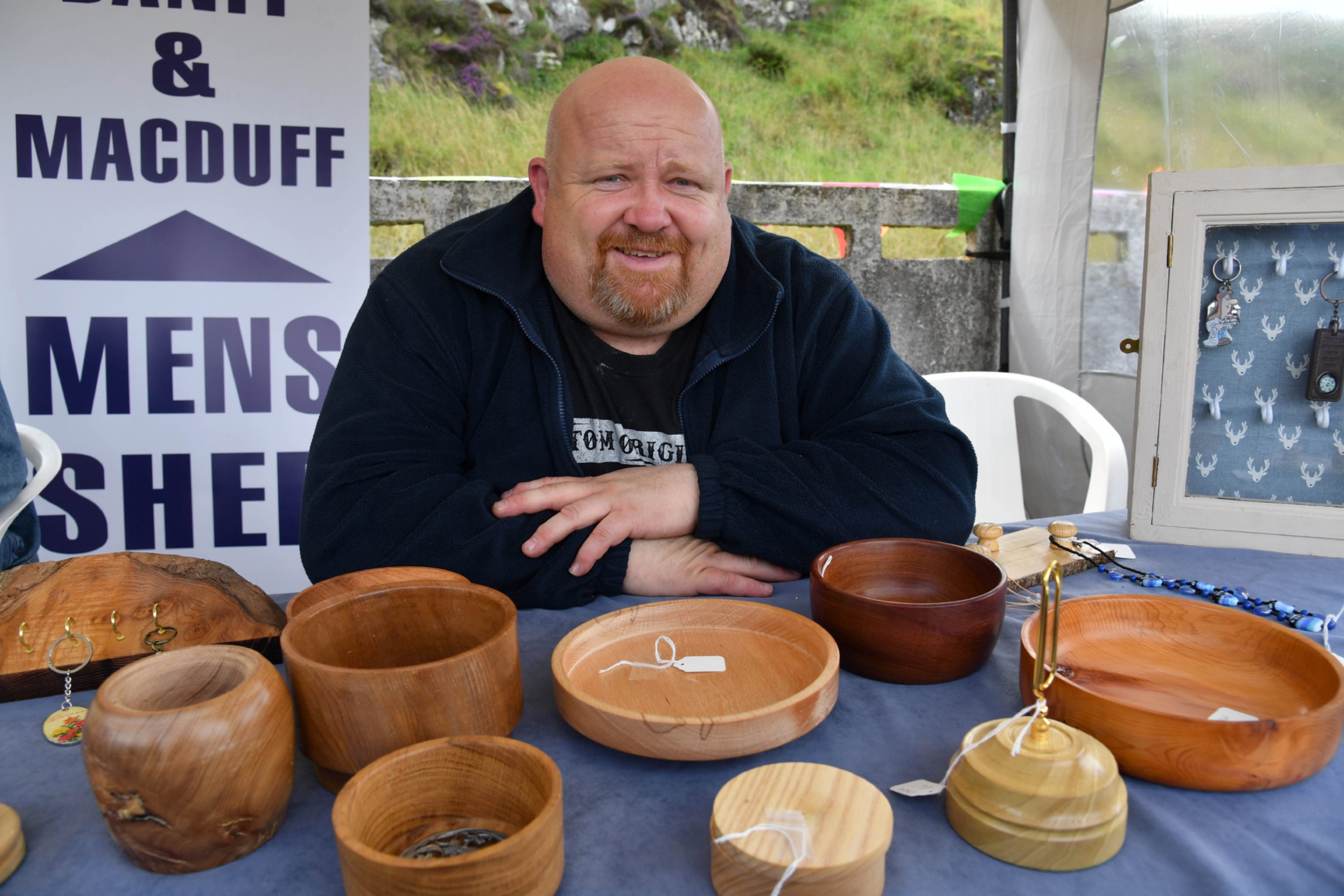 DAVY GAULT, VICE CHAIRMAN OF THE BANFF AND MACDUFF MENS SHED, WITH SOME OF THE ITEMS THE MEMBERS HAVE BEEN PRODUCING.