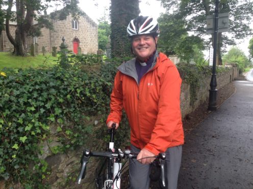 Reverend Robert Brookes getting ready for his cycle challenge.