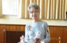 Roseanna Youngson of Banff Parish Church Busy Hands Group with a few of the angels they have knitted