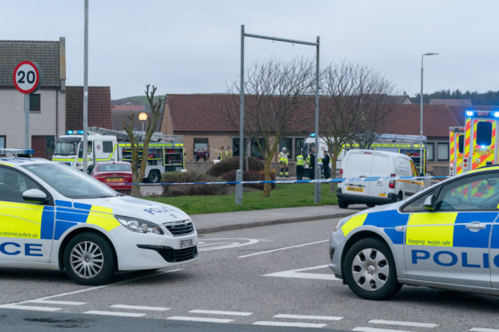 This is the scene of the Fire at Redwell Court, Whitehills, Aberdeenshire, Scotland. It is thought that the accomodation is part of a Shelterted Housing Complex owned by Aberdeenshire Council. At the scene are 3 Fire Engines, 2 Fire Support Units, 3 Ambulances and 3 Police vehicle. It is apparent that Ambulance are doing CPR in the garden of the property. Photographed by JASPERIMAGE ©.