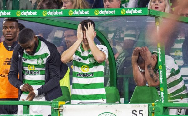 (L-R) Celtic's Olivier Ntcham, Mickey Johnston and Scott Brown looking dejected.