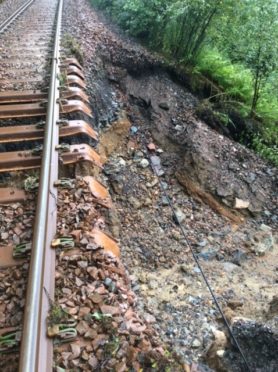 Where the rail line has been left exposed after a landslip.