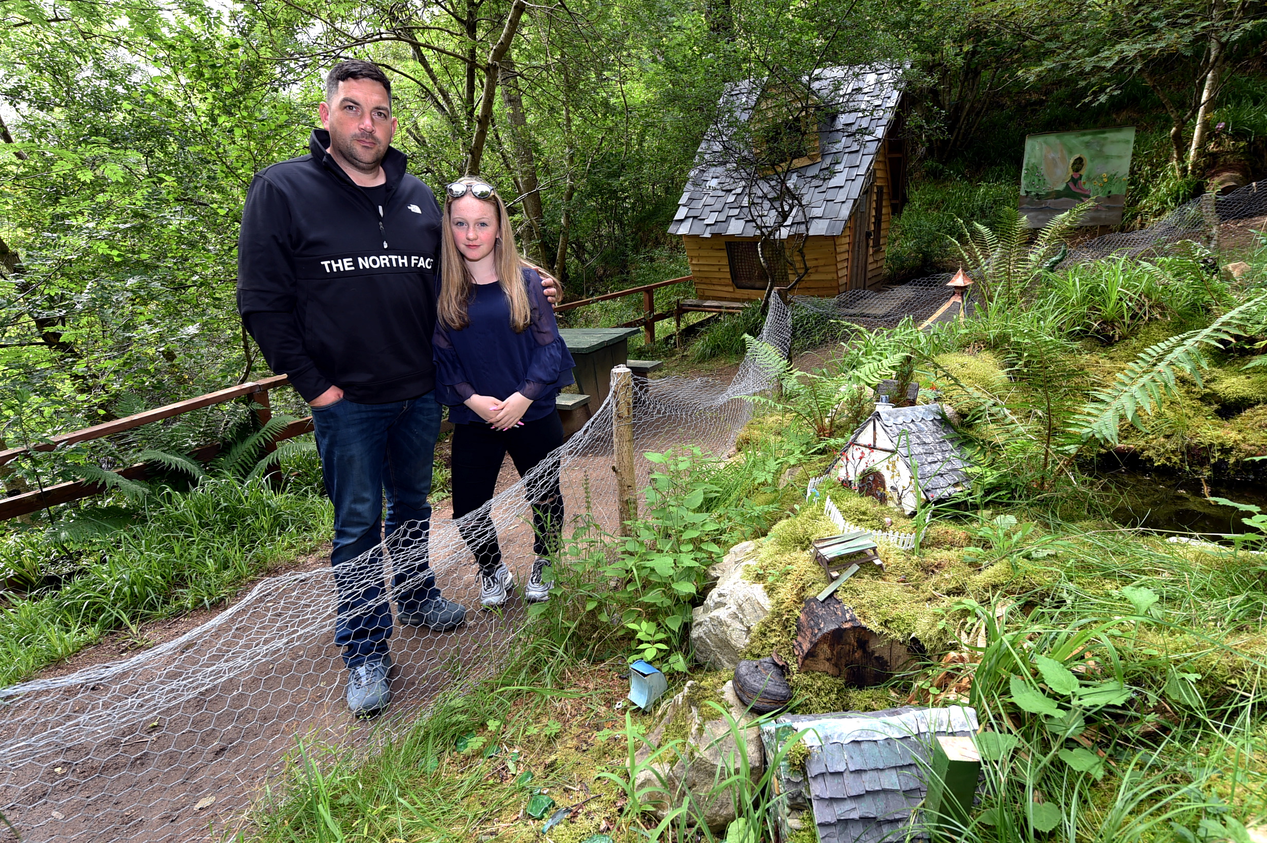 Dave Brown at his fairy village near Dufftown with his 14-year-old daughter. Picture by Jim Irvine