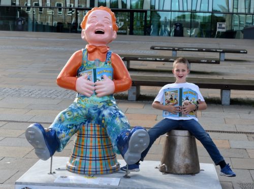 Jamie Lytham, from Mintlaw Academy has collected all 200 Oor Wullies across the country and is posing with his favourite statue at Aberdeen University.
Picture by Jim Irvine