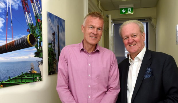 Stewart Stevenson MSP on a tour of the temporary Marine Centre for Moray East. Dalrymple Hall and Arts Centre, Fraserburgh. In the picture are from left: Marcel Sunier, project director and Stewart Stevenson MSP. 
Picture by Jim Irvine  28-8-19