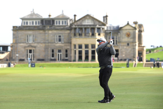 Justin Walters of South Africa plays his second shot on the first hole during day one of the Alfred Dunhill Links Championship at The Old Course. (Photo by Ross Kinnaird/Getty Images)