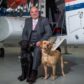 CHC’s Europe, Middle East and Africa Regional Director Mark Abbey with Copter and Ellie, who are trained by the Veterans With Dogs charity.