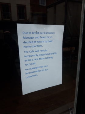 Notice on the window of Cafe Ecosse in Fort William