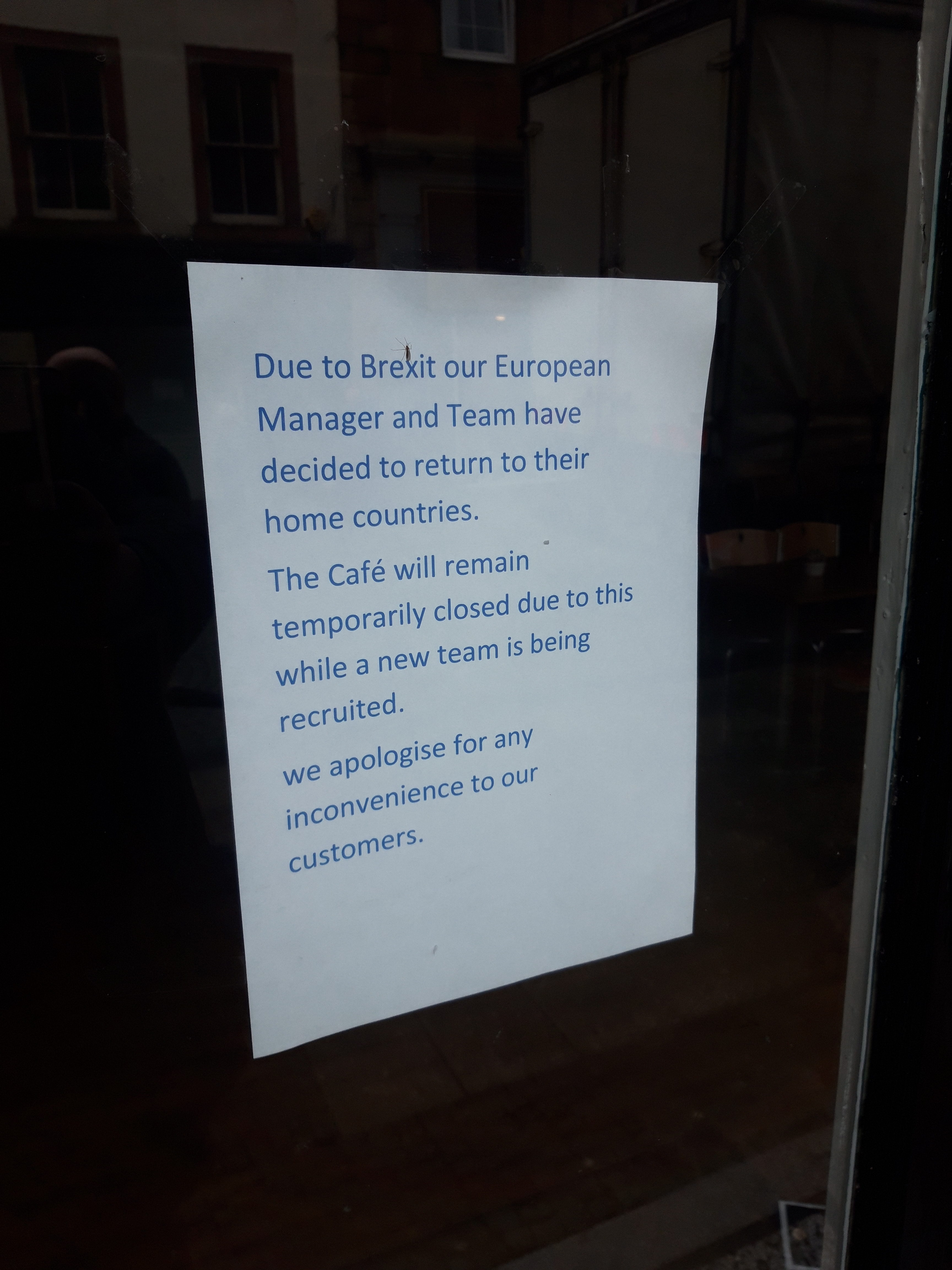 Notice on the window of Cafe Ecosse in Fort William