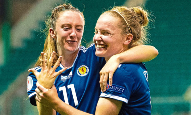 Lisa Evans (L) shares a joke with Kim Little following victory over Cyprus