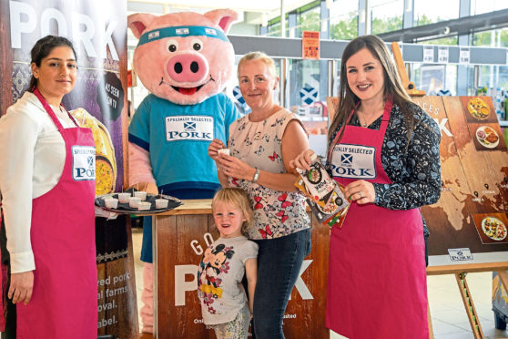 Customers Gillian Gove and daughter Billie Gray joined Aberdeenshire farmer Lynn Argo (far right) and one of the Specially Selected Pork brand ambassadors at Lidl in Aberdeen.