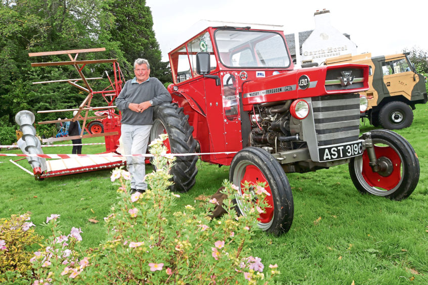 Gordie Green from Cromdale with a Massey Ferguson 130 tractor and corn/barley binder.