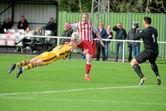 Formartine's Scott Lisle, Forres' Graham Fraser and goalie Stuart Knight.

Picture by KATH FLANNERY