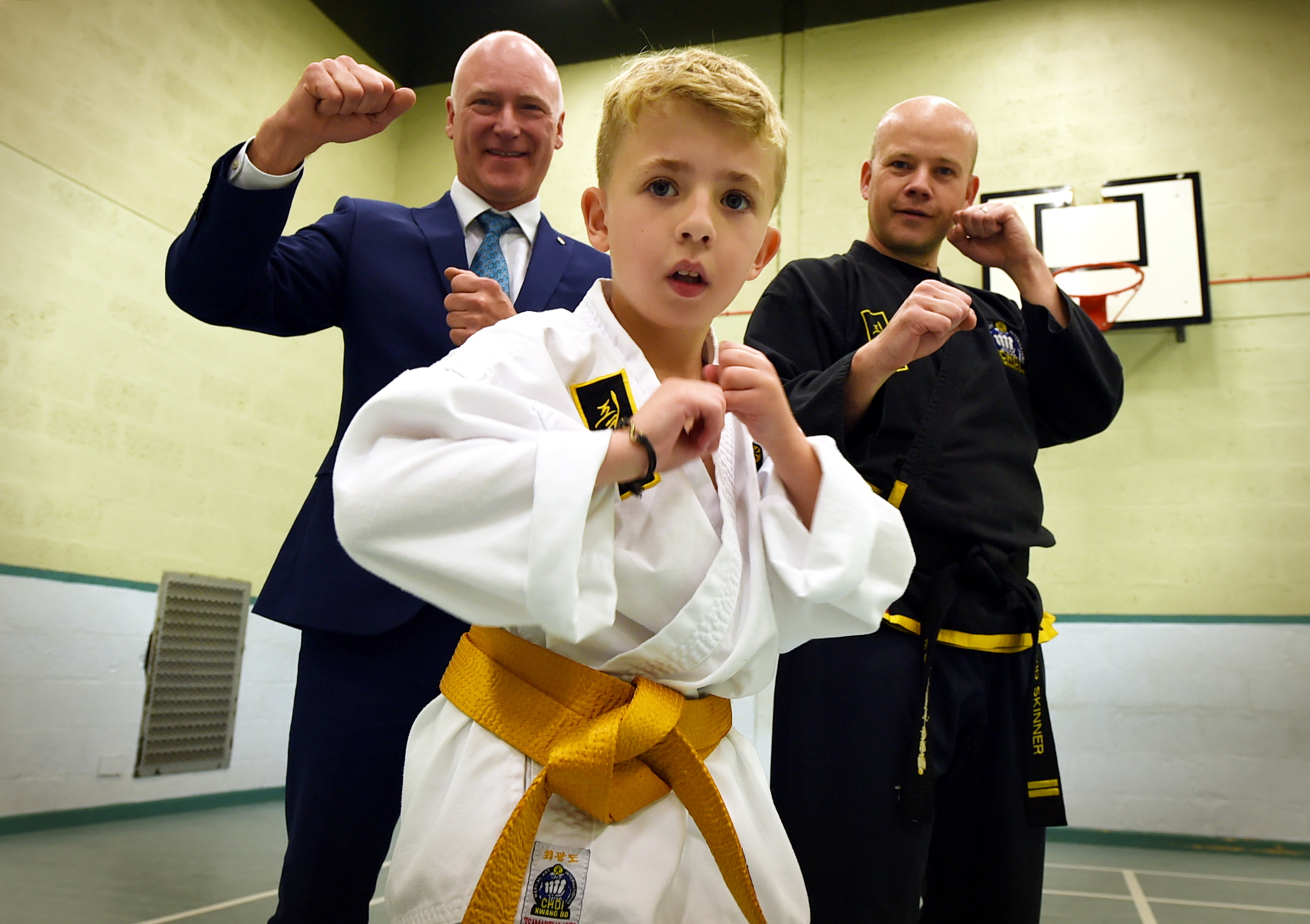 Alex Crichton practices his Choi Kwang-Do with instructor Dave Skinner and Public Health Minister Joe FitzPatrick