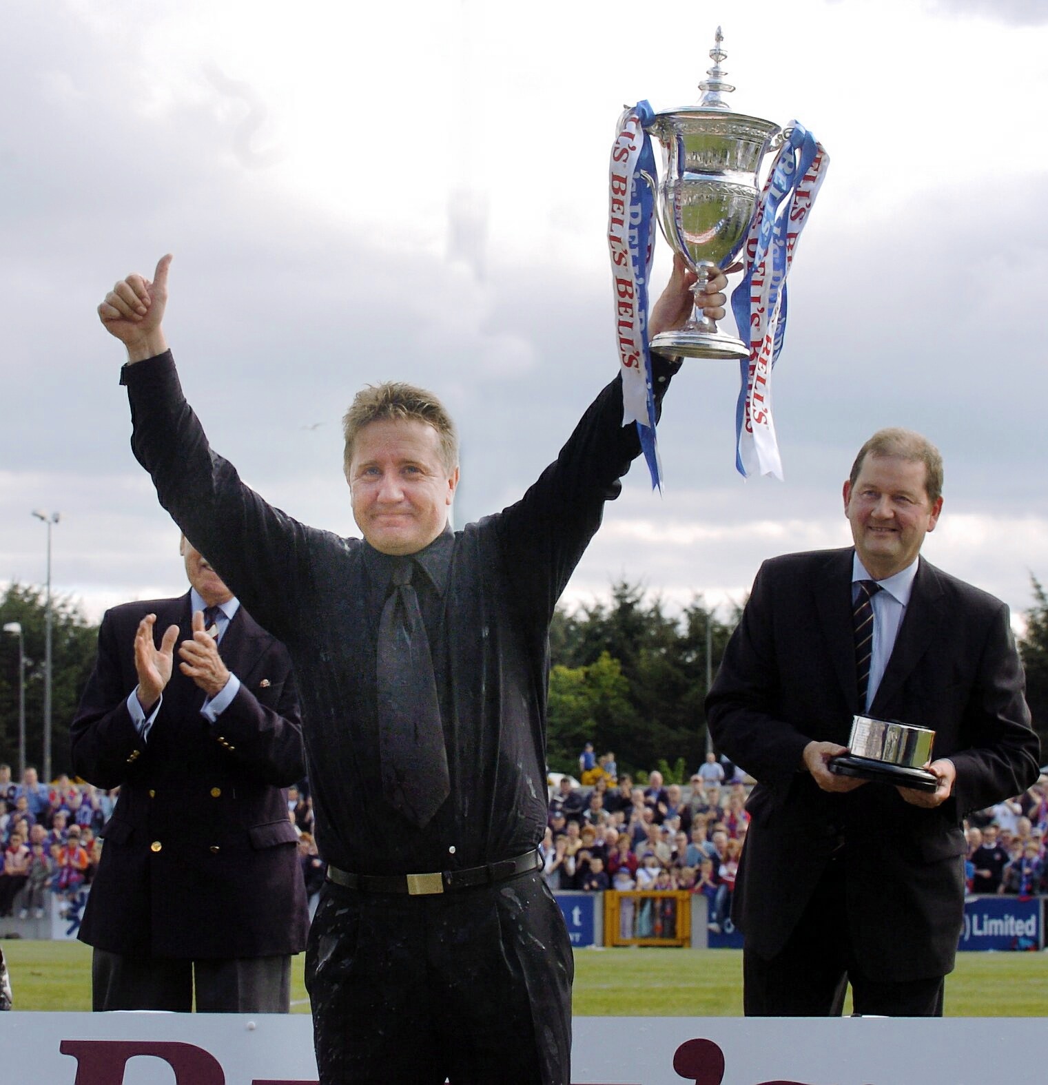 John Robertson proudly showing off the First Division trophy in May 2004. Picture by Sandy McCook