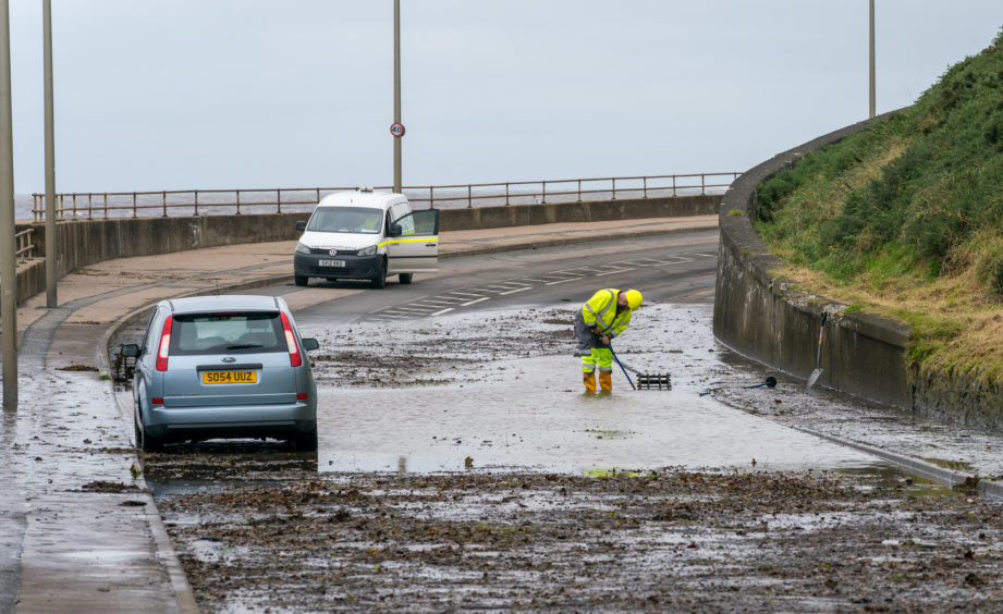Aberdeenshire Council working at the scene of the flooded area between Banff Bridge and Macduff