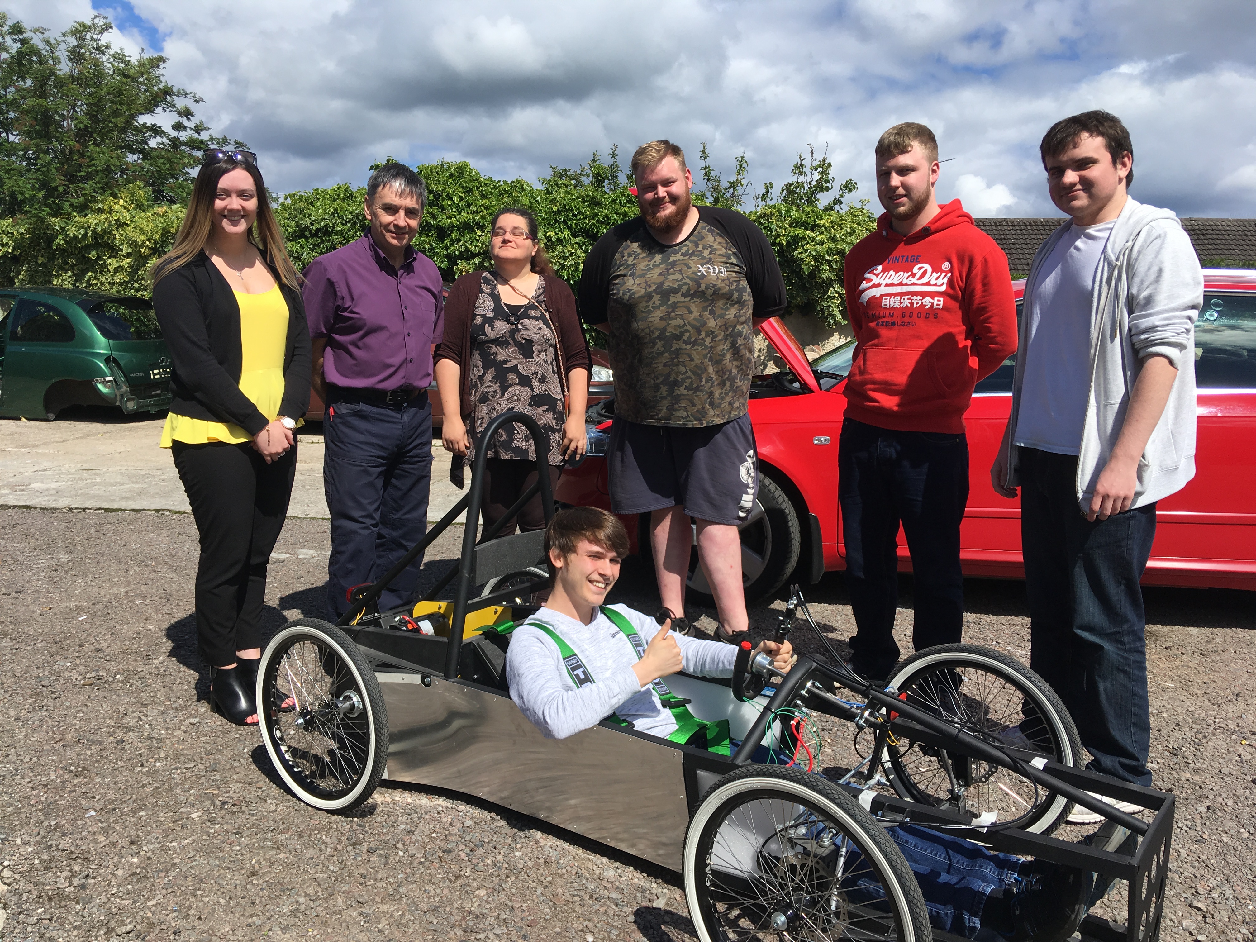 The completed car. Pictured standing: Aimee Stephen from DYW Moray, lecturer Paul Rochford and students Charlotte Usher, Morgan Brown, David Stewart, John Dalmon. Sitting: Jamie Smith.