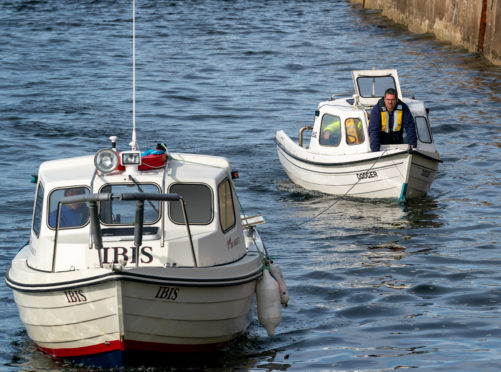 The  boat being towed back to Hopeman Harbour