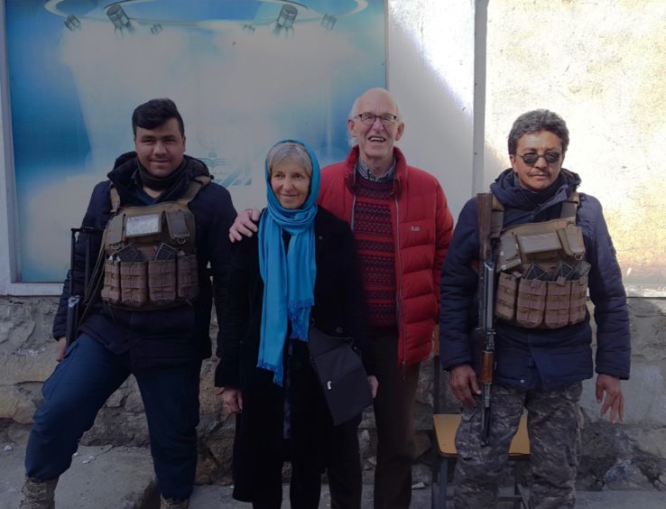 John and Lorna with their security on a visit to Afghanistan