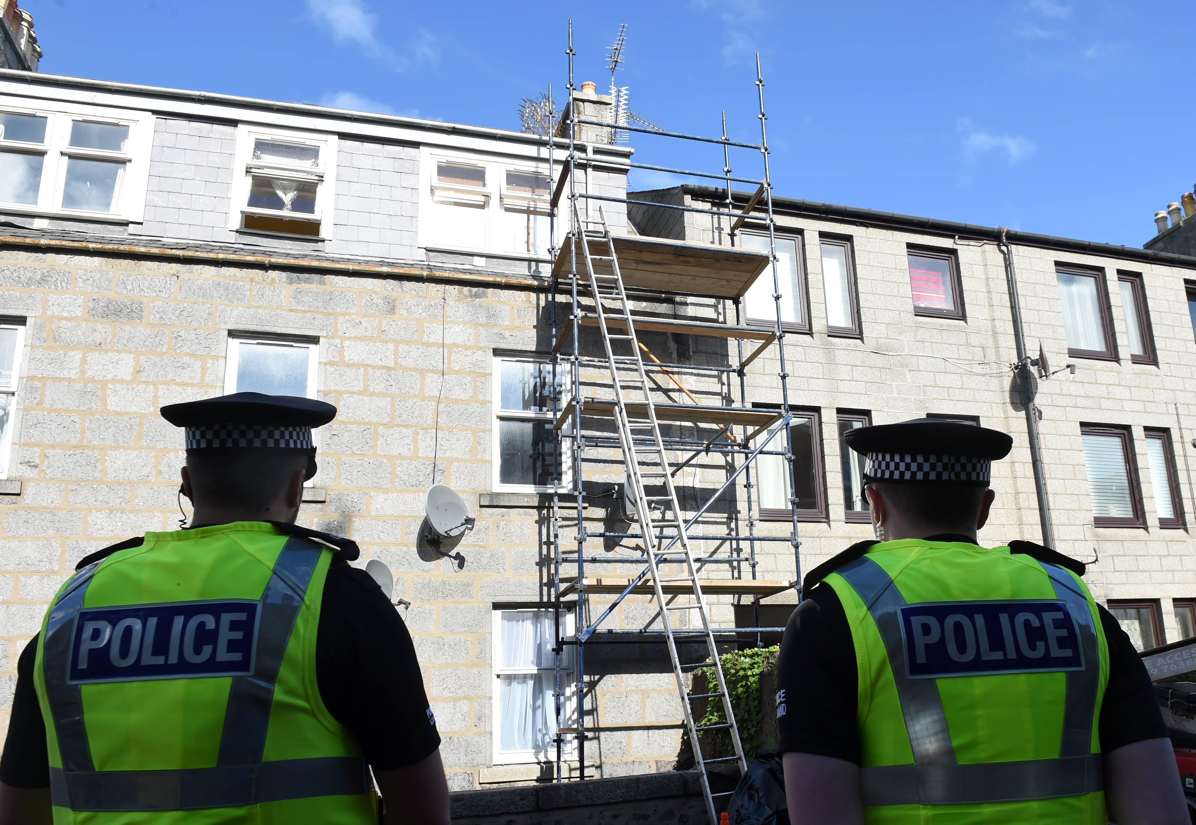 Police look at the scaffolding on Jute Street in September 2016.