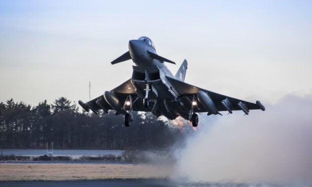 An RAF Lossiemouth Typhoon fighter jet takes off on a Quick Reacion Alert scramble.