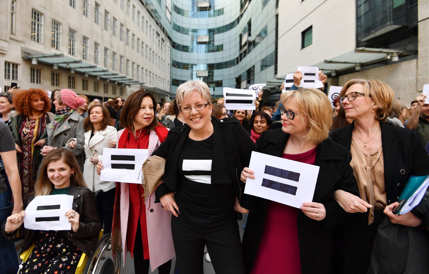 Journalist Carrie Gracie (centre) and BBC employees gather outside Broadcasting House in London, to highlight equal pay on International Women's Day. PRESS ASSOCIATION Photo. Picture date: Thursday March 8, 2018. See PA story MEDIA Women. Photo credit should read: John Stillwell/PA Wire