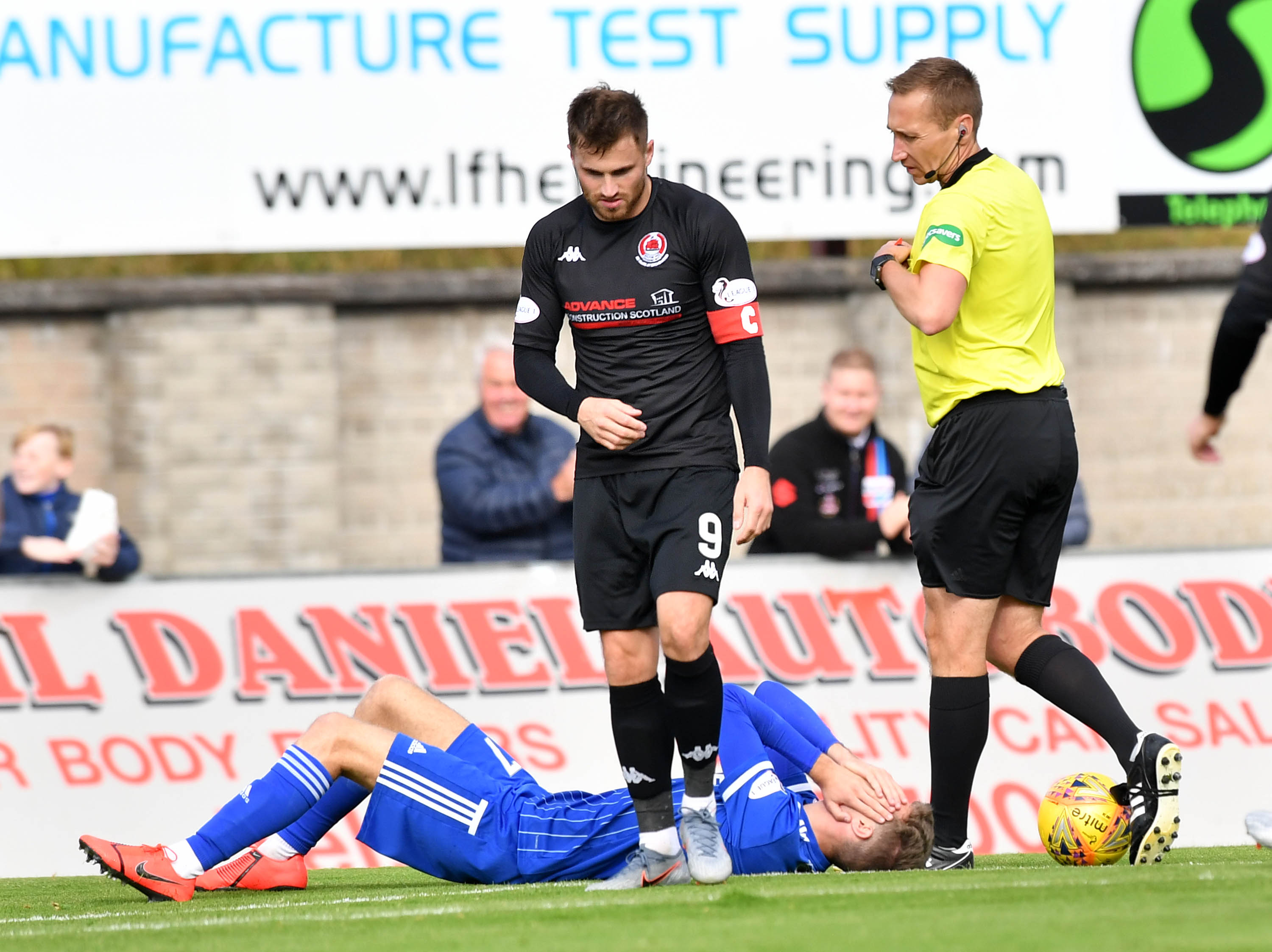 REFEREE STEVEN KIRKLAND REACHES FOR THE RED CARD FOR DAVID GOODWILLIE  AFTER HIS CHALLENGE ON DAVID FERGUSON
