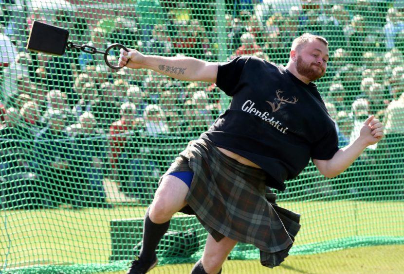 Jamie Gunn throwing the 56lb weight.

Picture by KENNY ELRICK