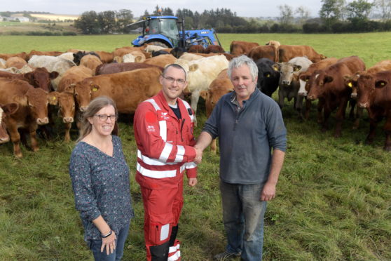 Donna and Steven Donald pictured with SCAA volunteer Ewan Littlejohn 

Picture by KATH FLANNERY