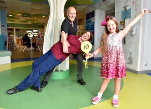 Lucy Stewart, pictured right, with clinical nurse manager Julie Mulliner and Aberdeen Maternity Hospital theatre team lead David Imison. 


Picture by Scott Baxter    04/07/2019