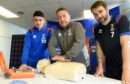 All staff and players of Inverness Caledonian Thistle had training in the use of defibrillators. John Robertson explains the procedure to players Aaron Dorran and James Keetings. Picture by Sandy McCook