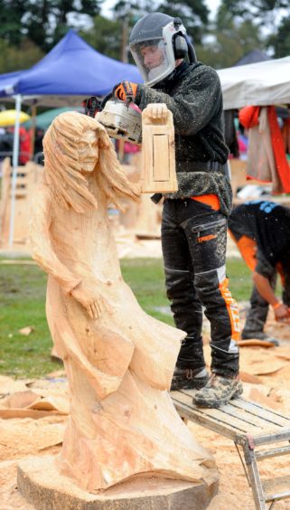 Michael Tamoszus creating his winning carving. Picture by Sandy McCook