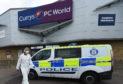 Forensic officers at the scene in Springfield Retail Park. Picture by Jason Hedges.