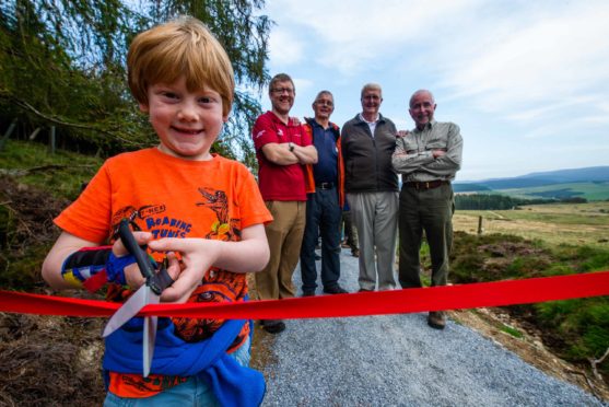 From left: Henry Moir 7, Grant Moir (CNPA),  Tony Birchall from Glenlivet Walking Group,  Brian Fowler from Glenlivet Walking Group, Steve Smith (TGLP).