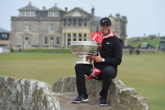 Denmarks Lucas Bjerregaard with the Alfred Dunhill Links trophy on the Swilken Bridge.