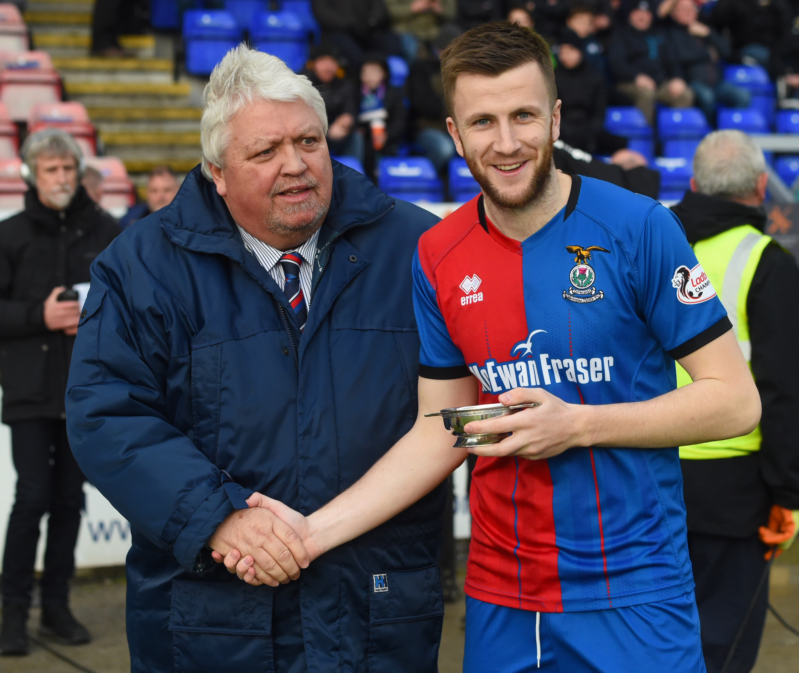 Outgoing Caley Thistle chairman Graham Rae, with former midfielder Liam Polworth.